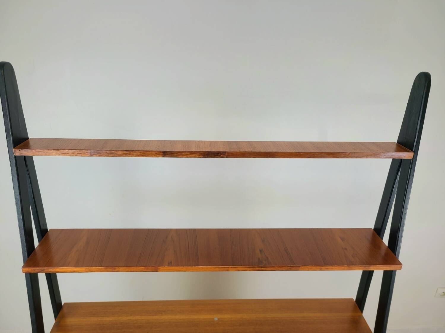 Vintage 1960s Scandinavian teak bookcase with compass legs