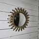 Witch's eye sun mirror in gold metal from the 60s