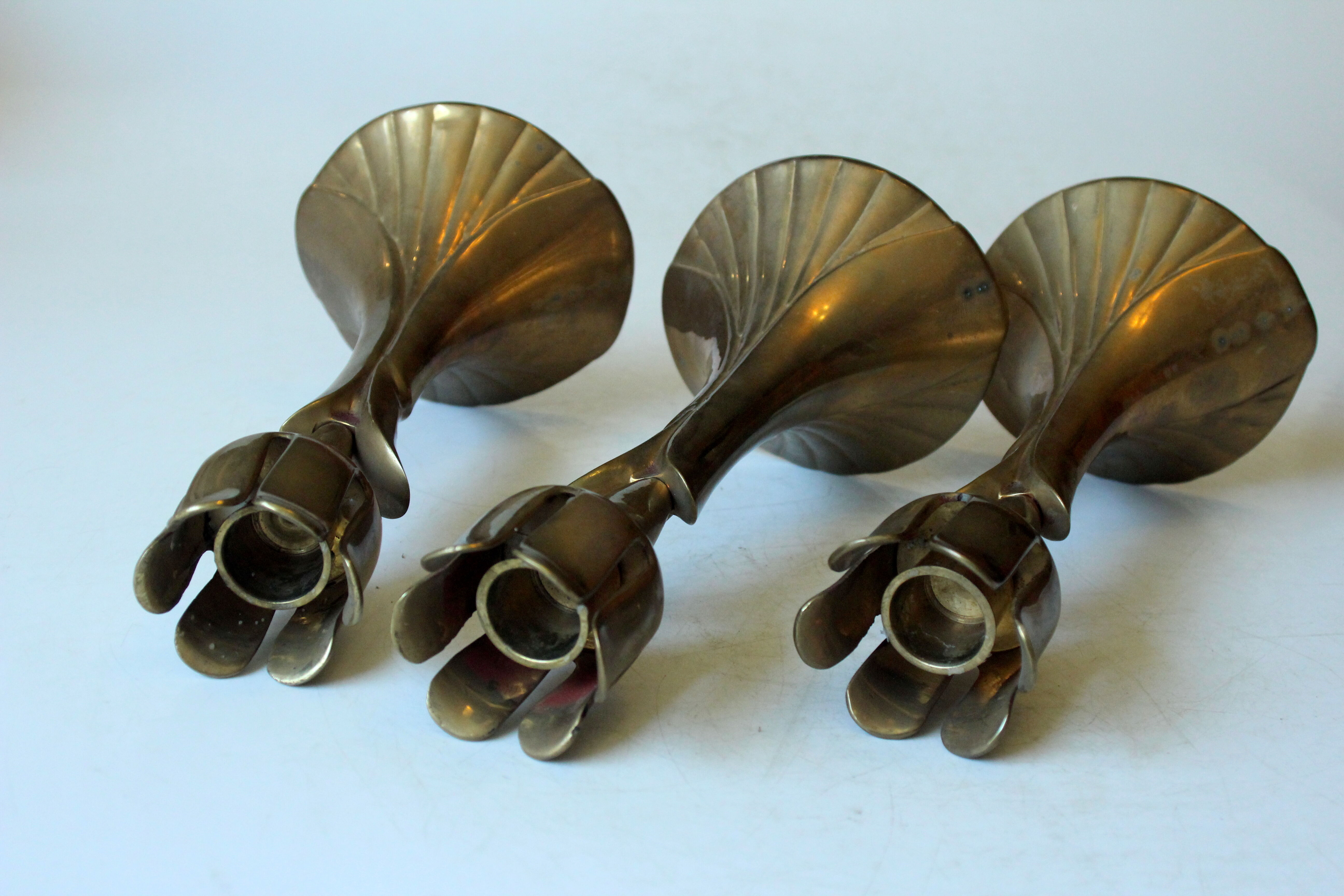 3 beautifull solid brass candle holders with floral motif, vintage from the 1960s