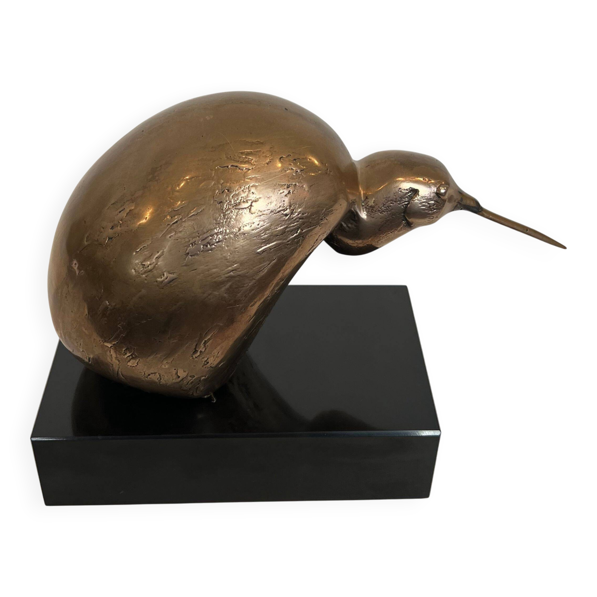 Bronze sculpture representing a stylised bird on a black marble base, signed and numbered.