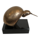 Bronze sculpture representing a stylised bird on a black marble base, signed and numbered.