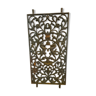 Cast iron grid with a horse