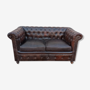 Chesterfield-style dark brown leather sofa