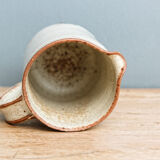 Enamelled sandstone milk jar, signed