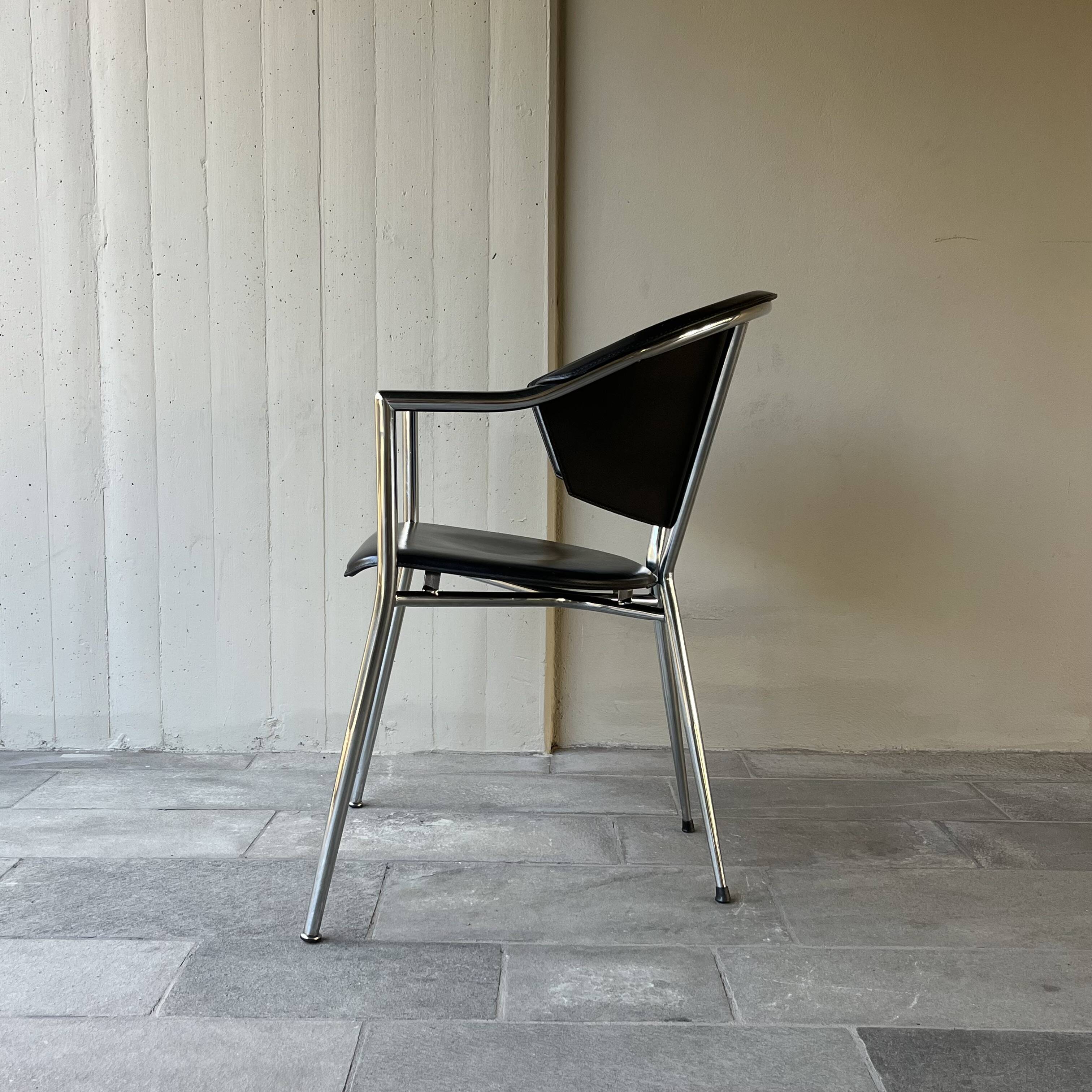 Set of four Italian black leather chairs, 1970