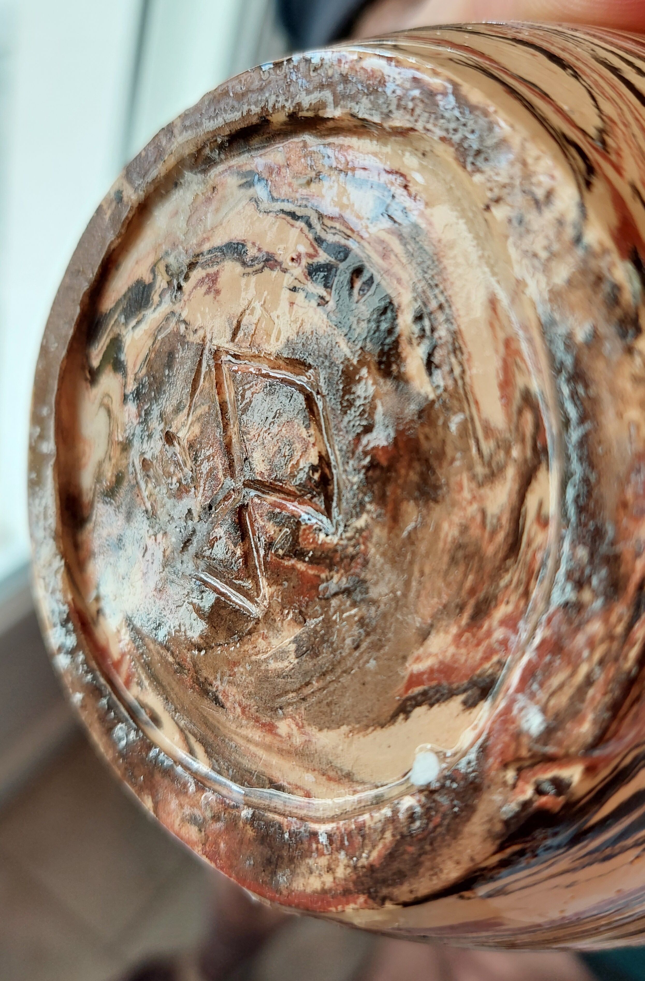 Sand, terracotta and brown soliflore vase in mixed earth