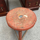 Red tripod industrial metal stool