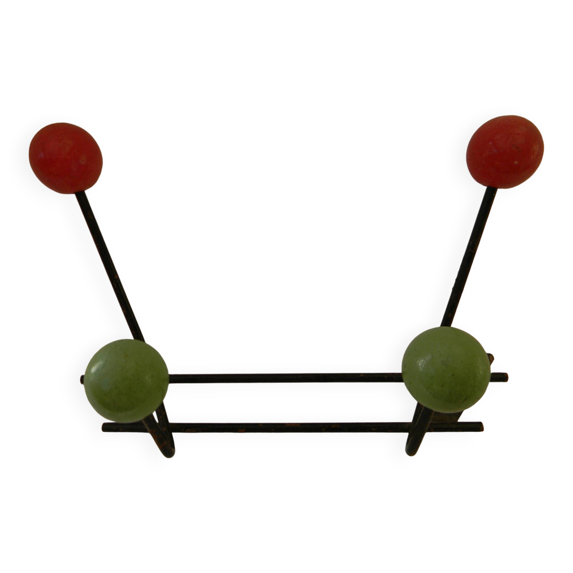 Small wrought iron coat rack with wooden balls.