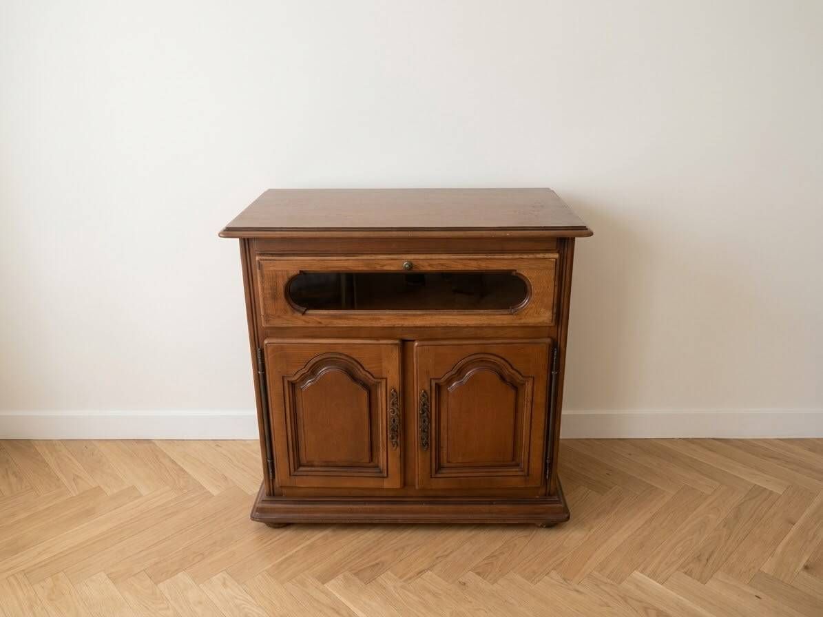 Rustic wooden TV unit with a swivel top and moulded doors.