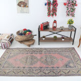 Tapis turc en laine rose poussiéreux
