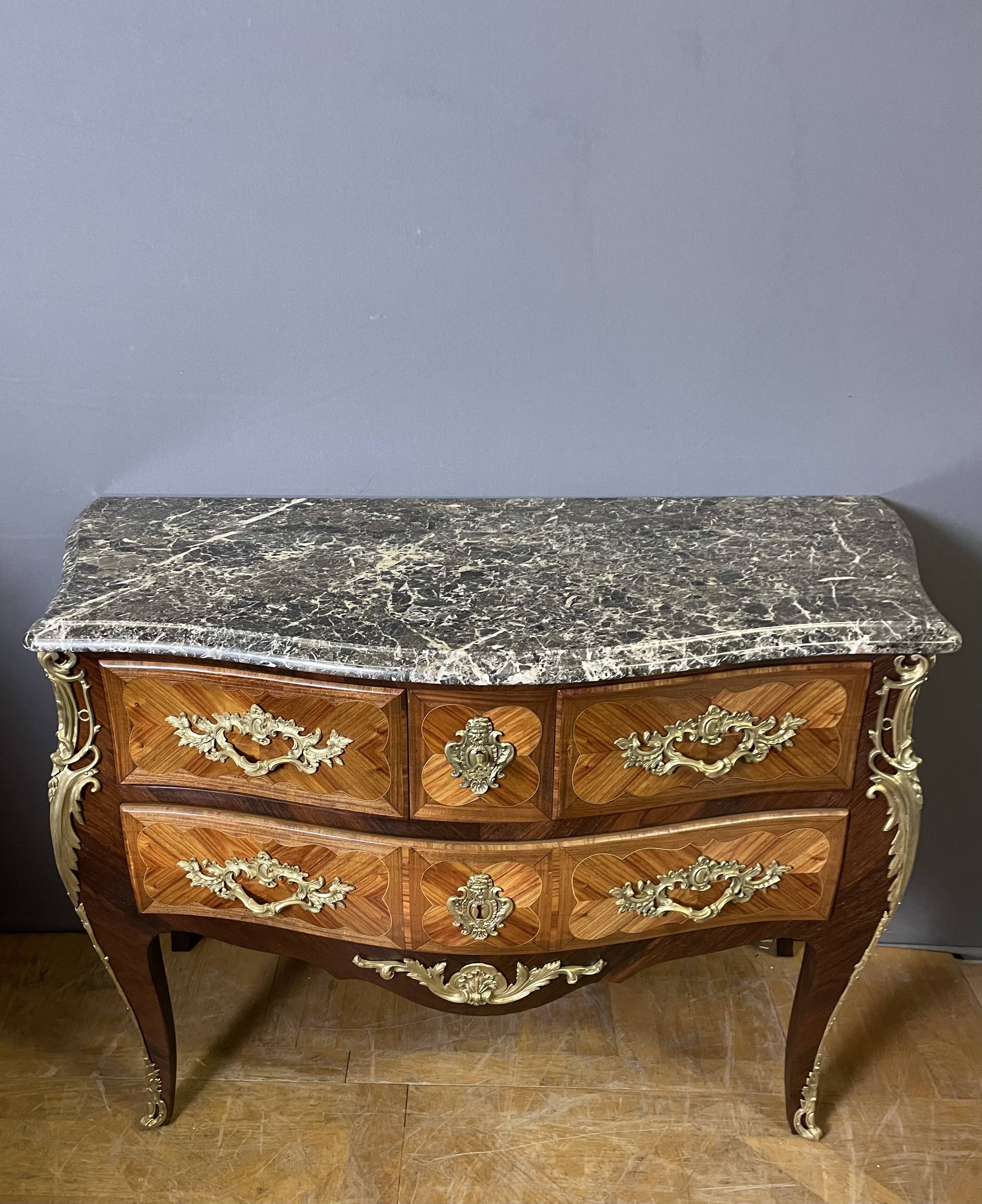 Louis XV style commode in marquetry from around 1920.