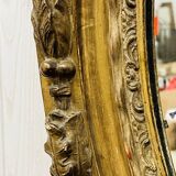 Large golden oval mirror