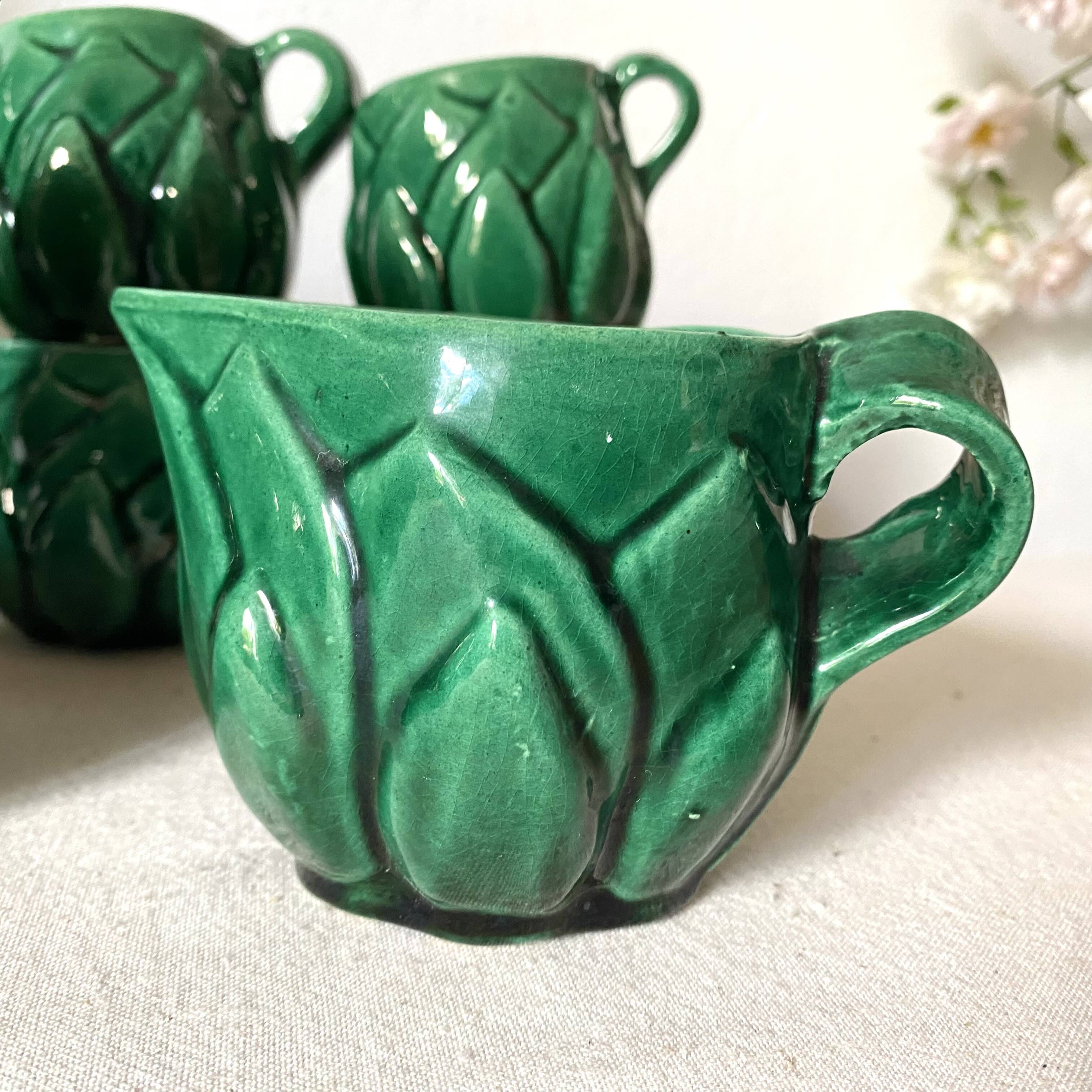 Antique slip cups with saucers, sugar bowl and milk pitcher