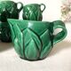 Antique slip cups with saucers, sugar bowl and milk pitcher