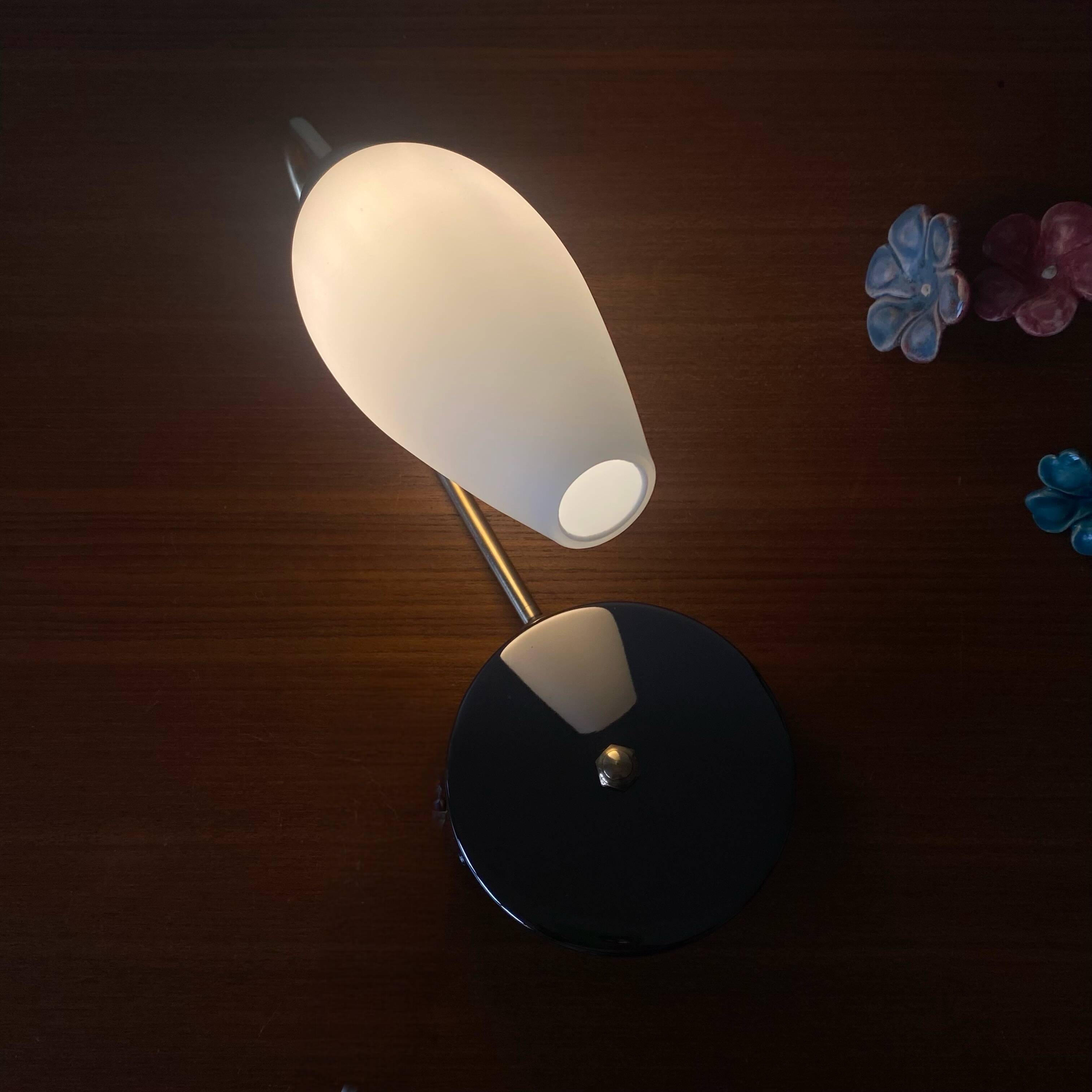 Swan neck wall light in brass and white opaline glass tulip.