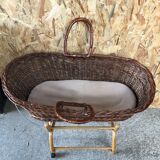 Old woven wicker baby cradle