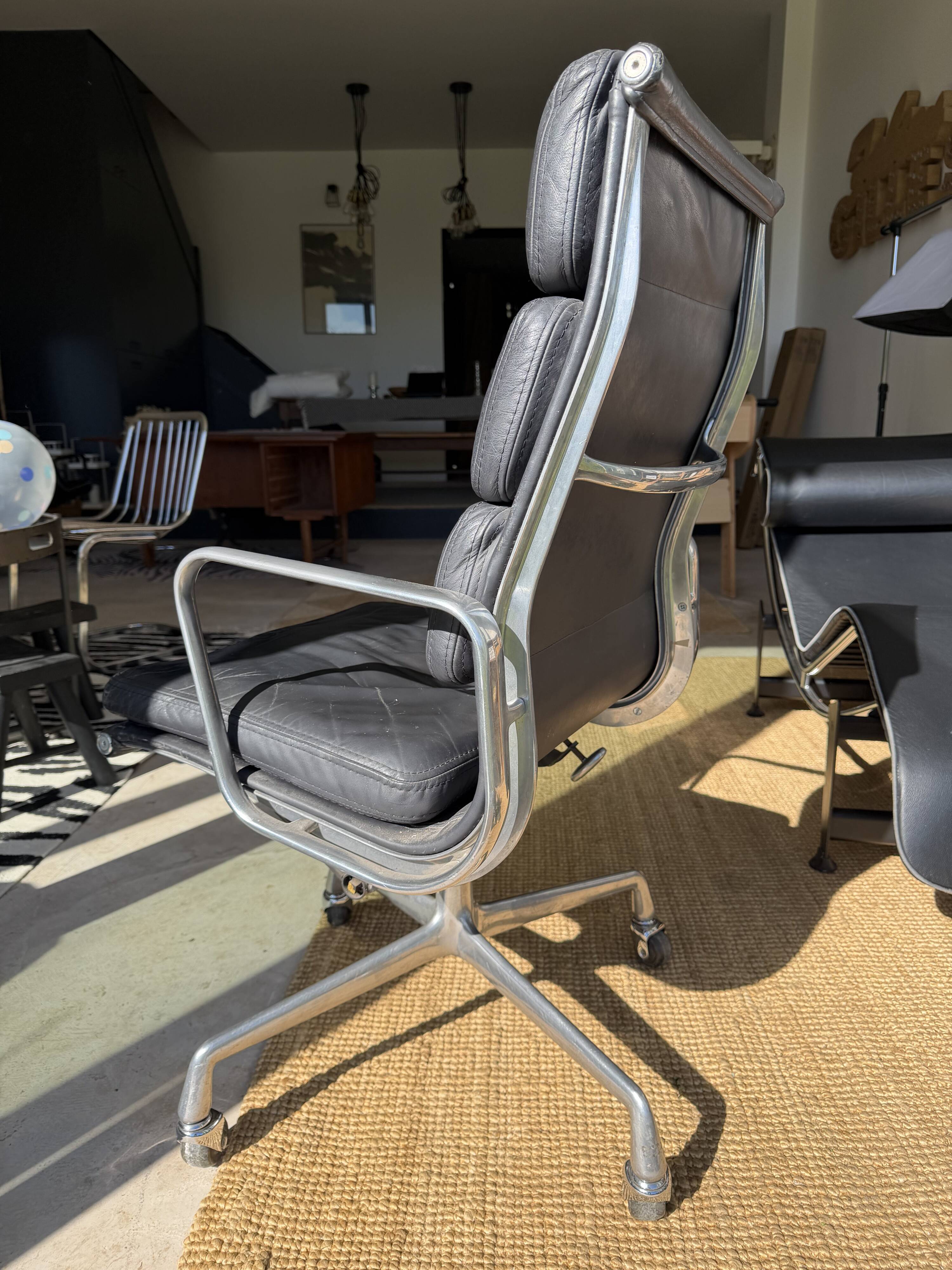 Eames soft pad chair in black leather, Herman Miller edition.