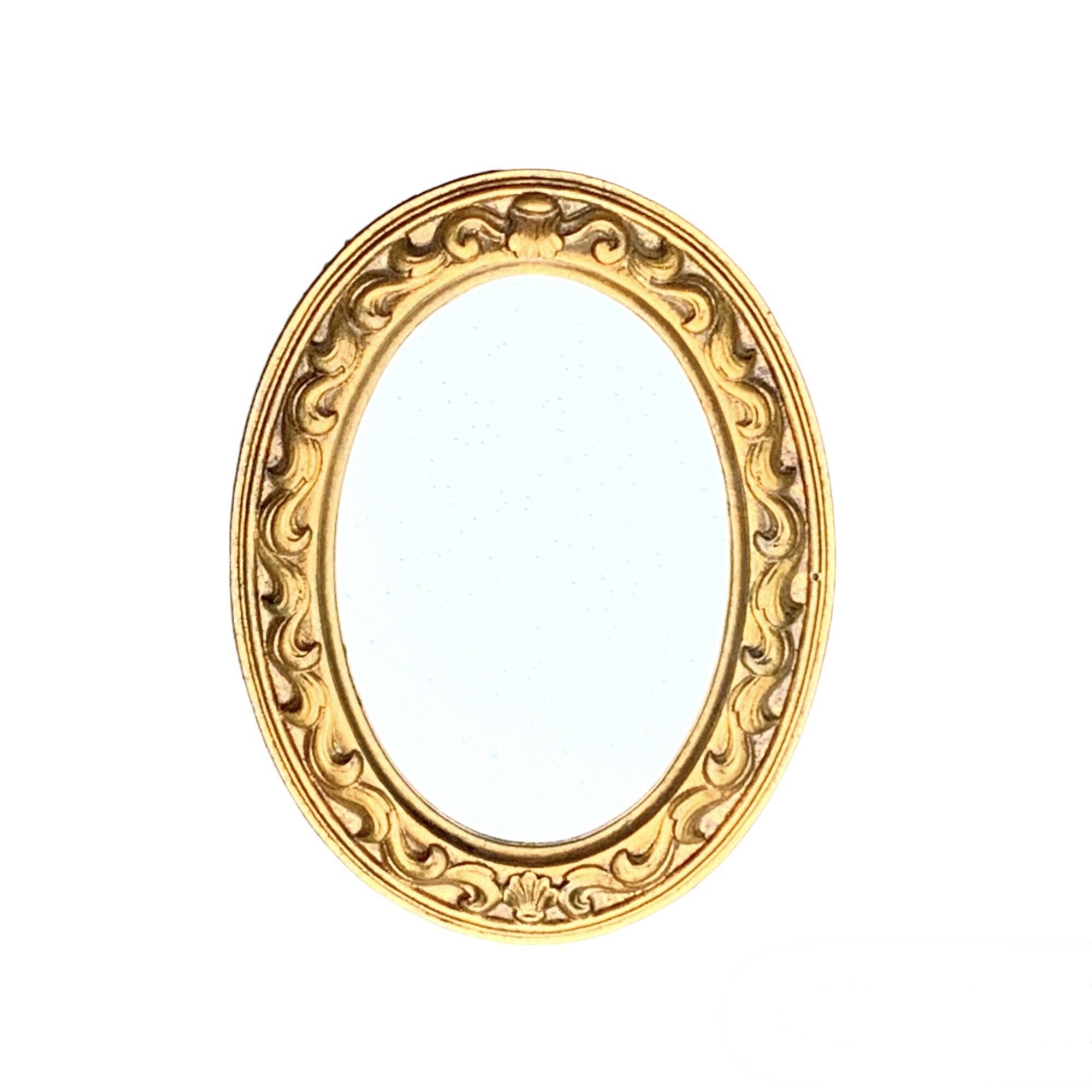 Small vintage wall mirror in gold resin