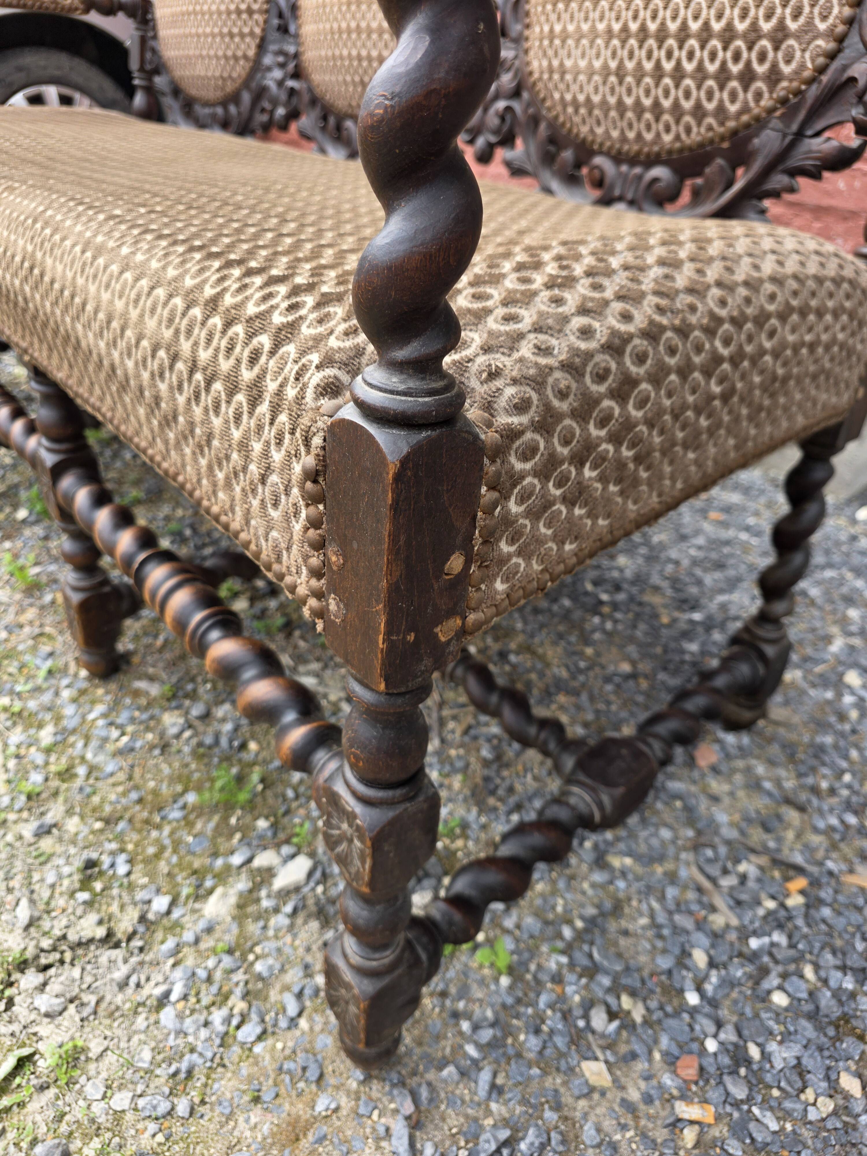 Three-seater armchair in Louis XIII style made of oak from the 19th century.