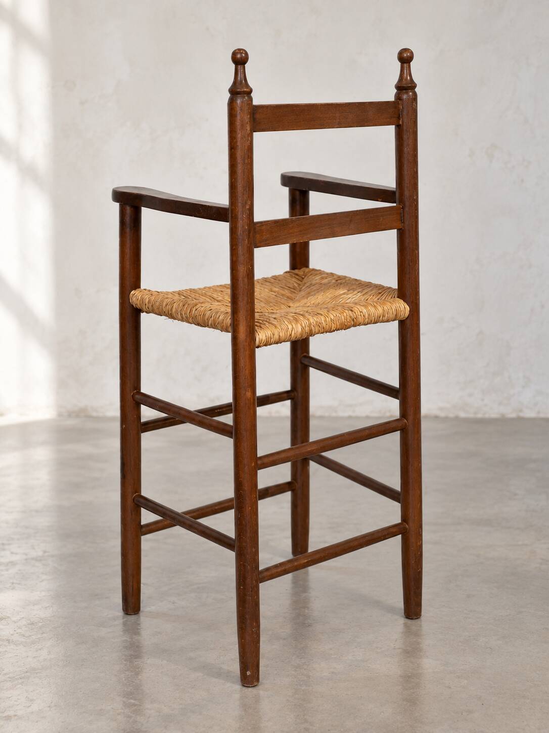 High chair made of straw and wood