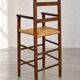 High chair made of straw and wood