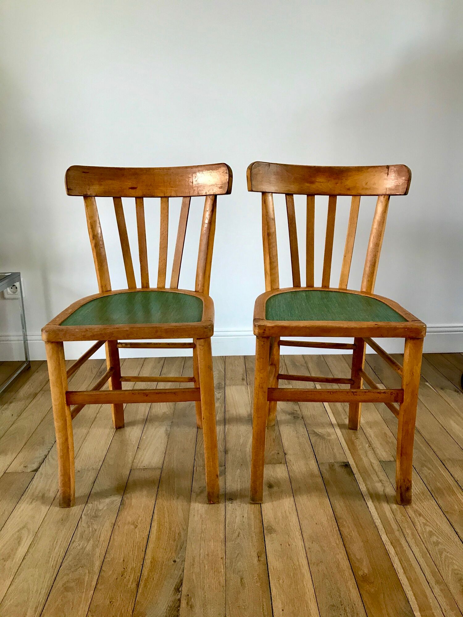 Pair of bistro chairs in light curved wood and green seat 1950s