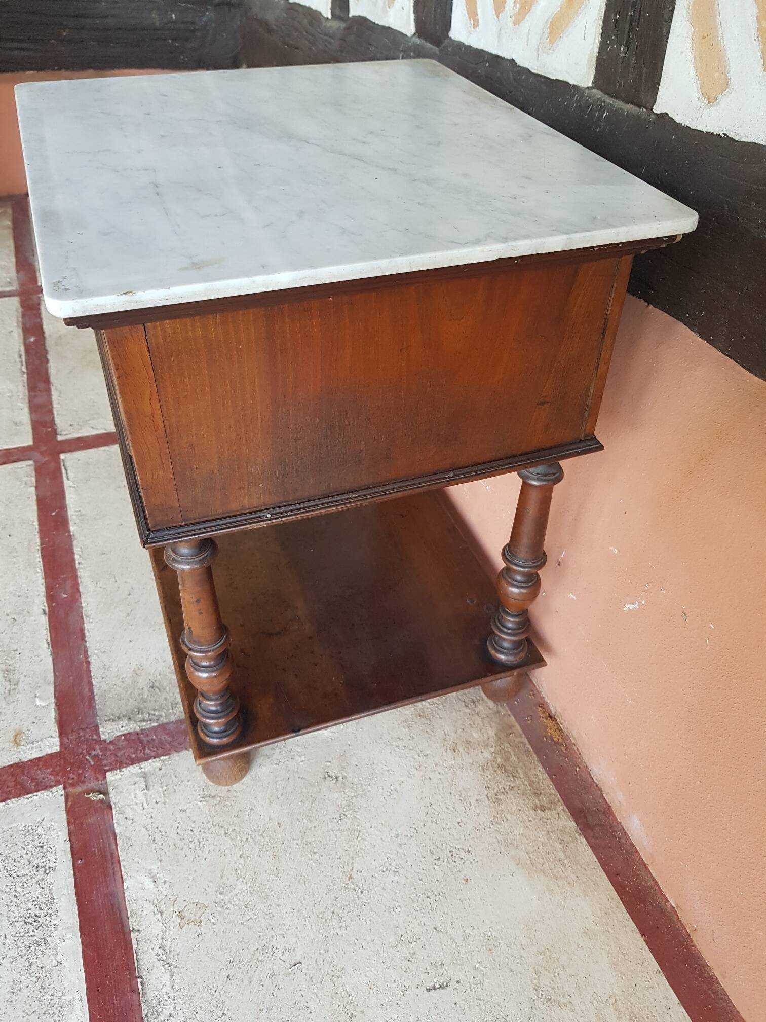 Old wooden marble bedside table
