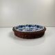 Set of 6 ceramic presentation plates in white and blue, floral pattern with woven wicker frame, 1970s/80s.