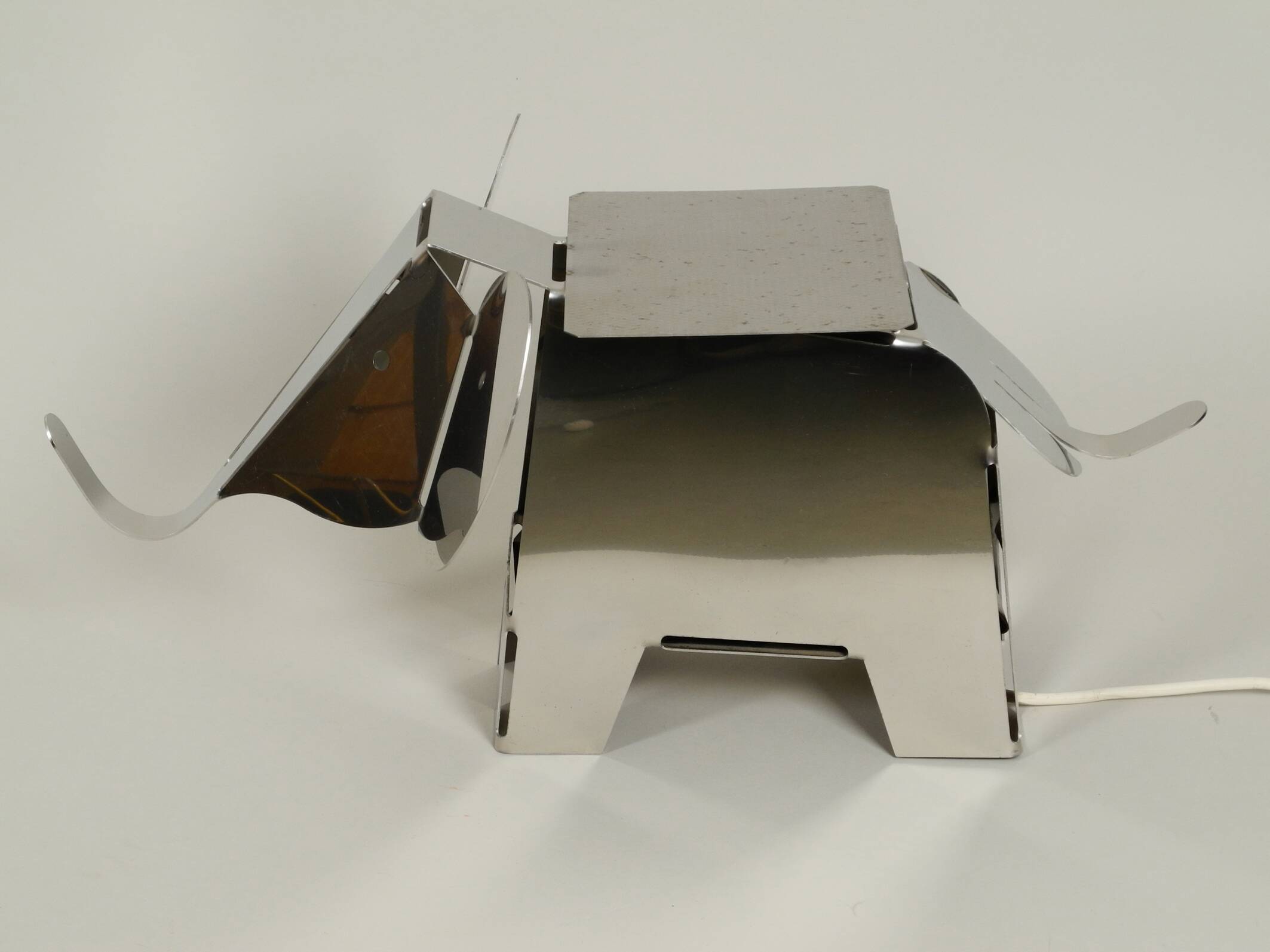 80s heavy metal chrome elephant floor lamp as side table Postmodern design