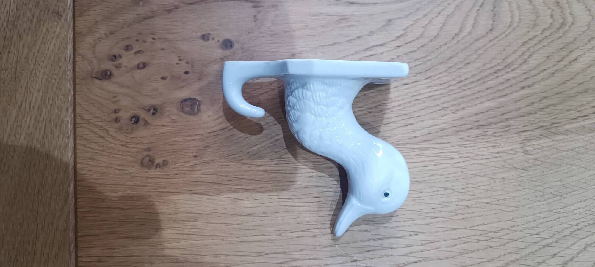 Wall-mounted duck head coat hook in white ceramic, cottagecore style.