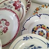 Set of 8 ironstone plates with coordinated designs.