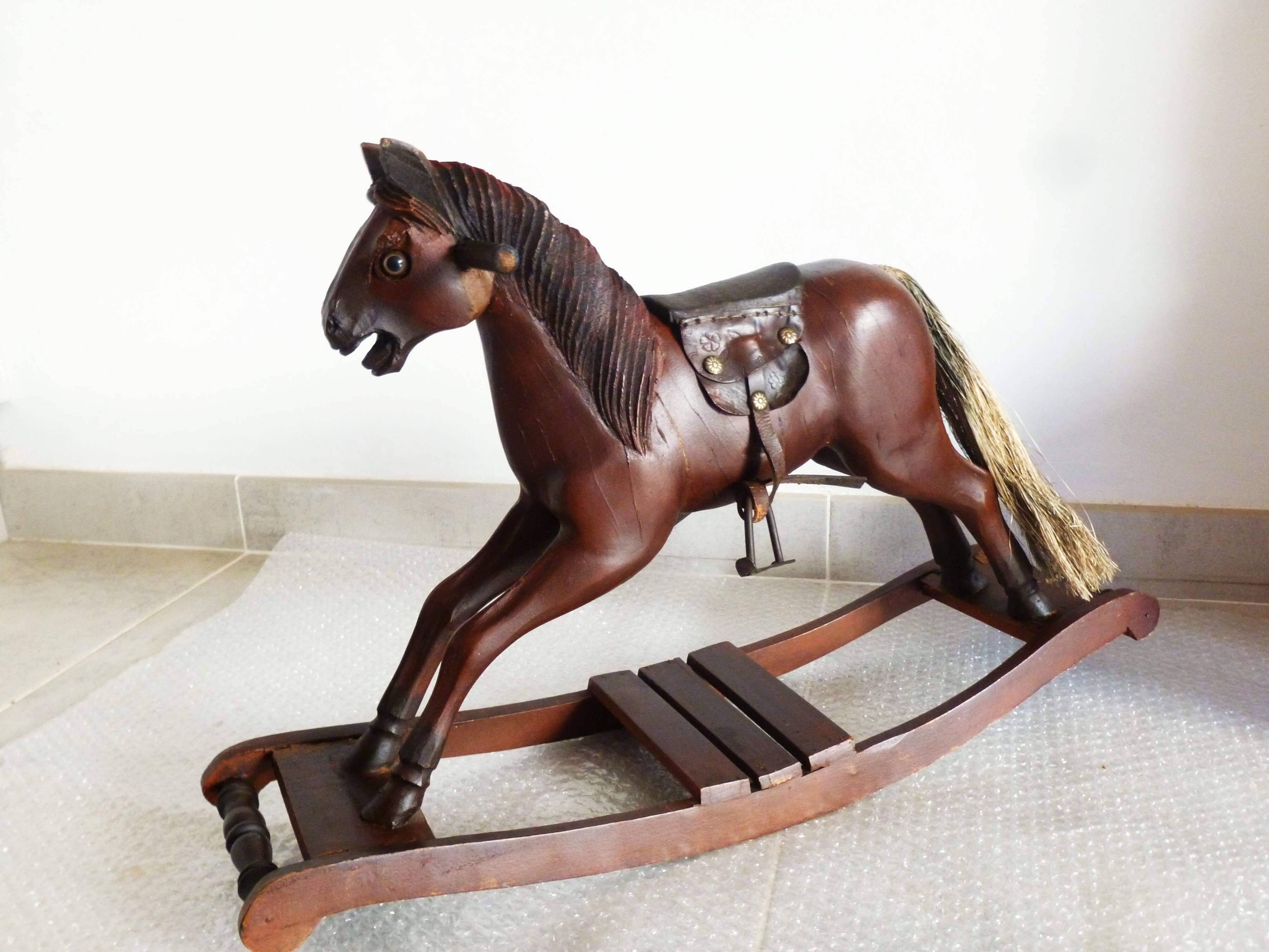 Antique wooden and leather rocking horse