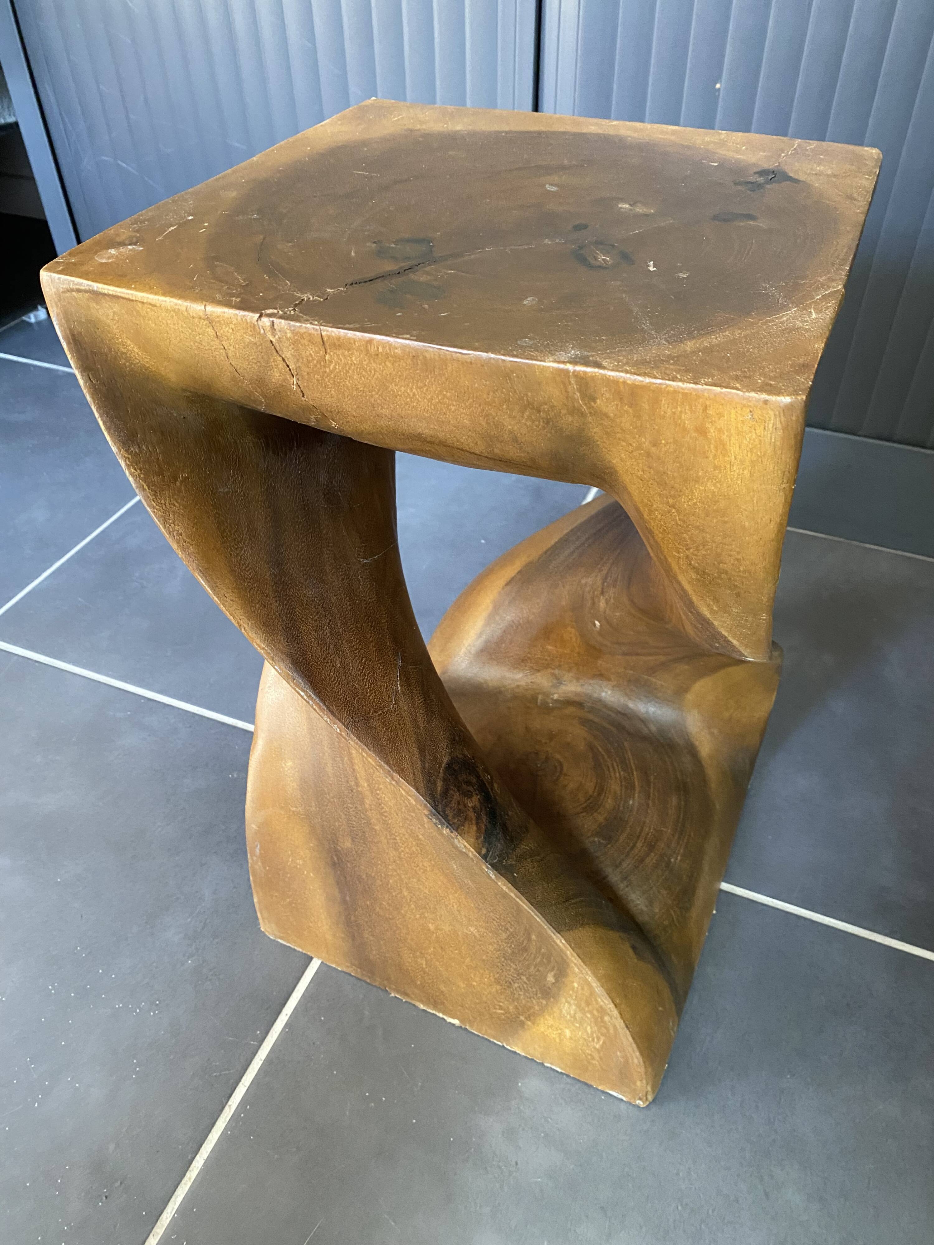 Stool n2 in solid raw walnut wood carved from the mass 1970