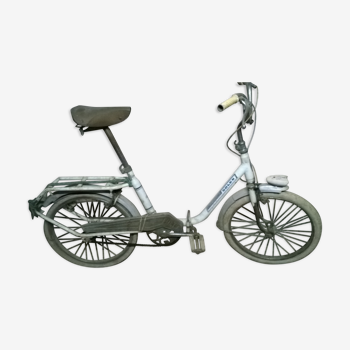 White and folding solex bike with luggage rack