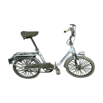 White and folding solex bike with luggage rack