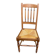 Solid wood chair with a straw seat and carved bar backrest.