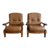 Pair of vintage 1970s armchairs in solid oak and cognac faux leather.