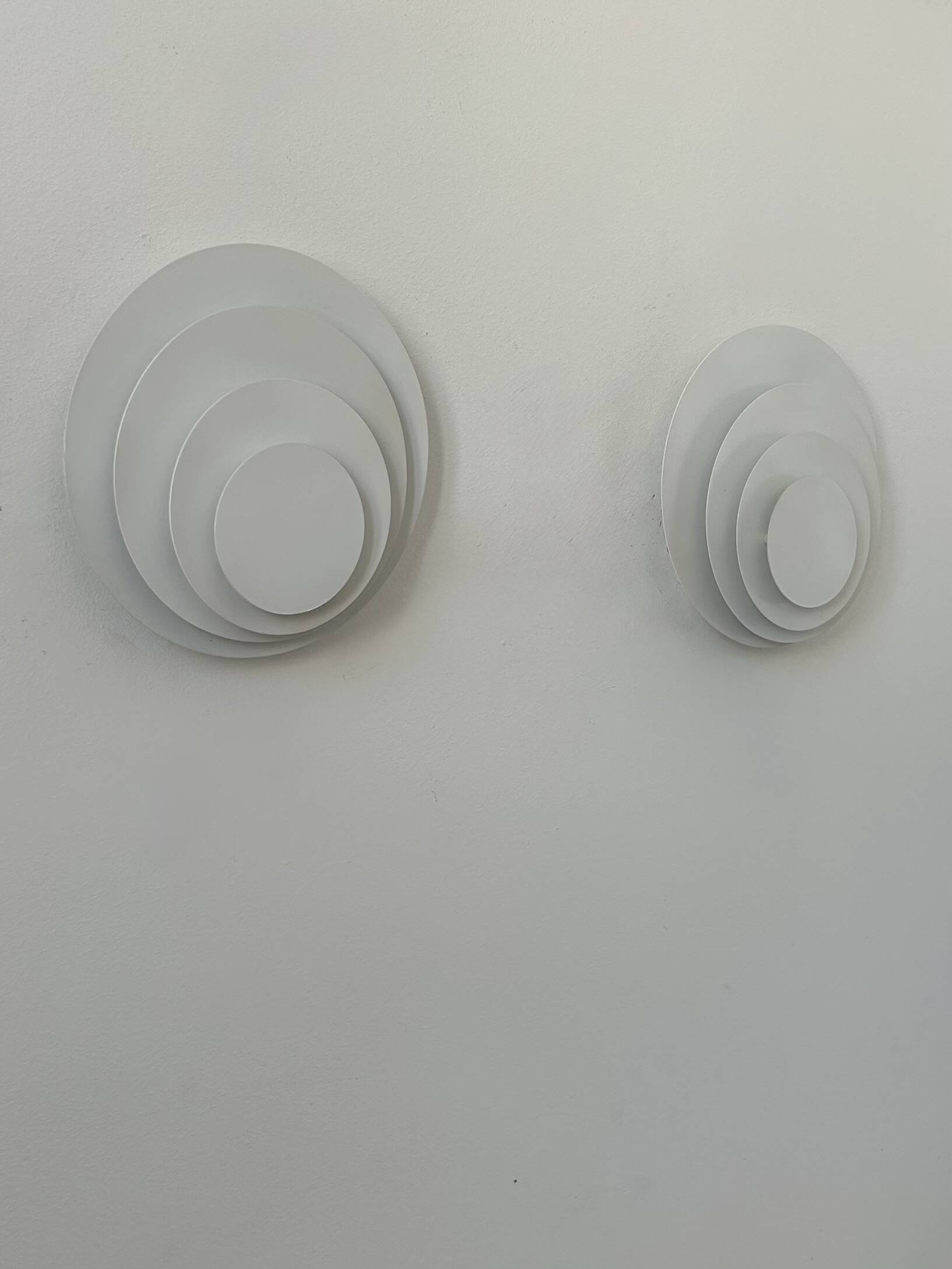 Pair of vintage wall lights, matte white metal, France, 1980.