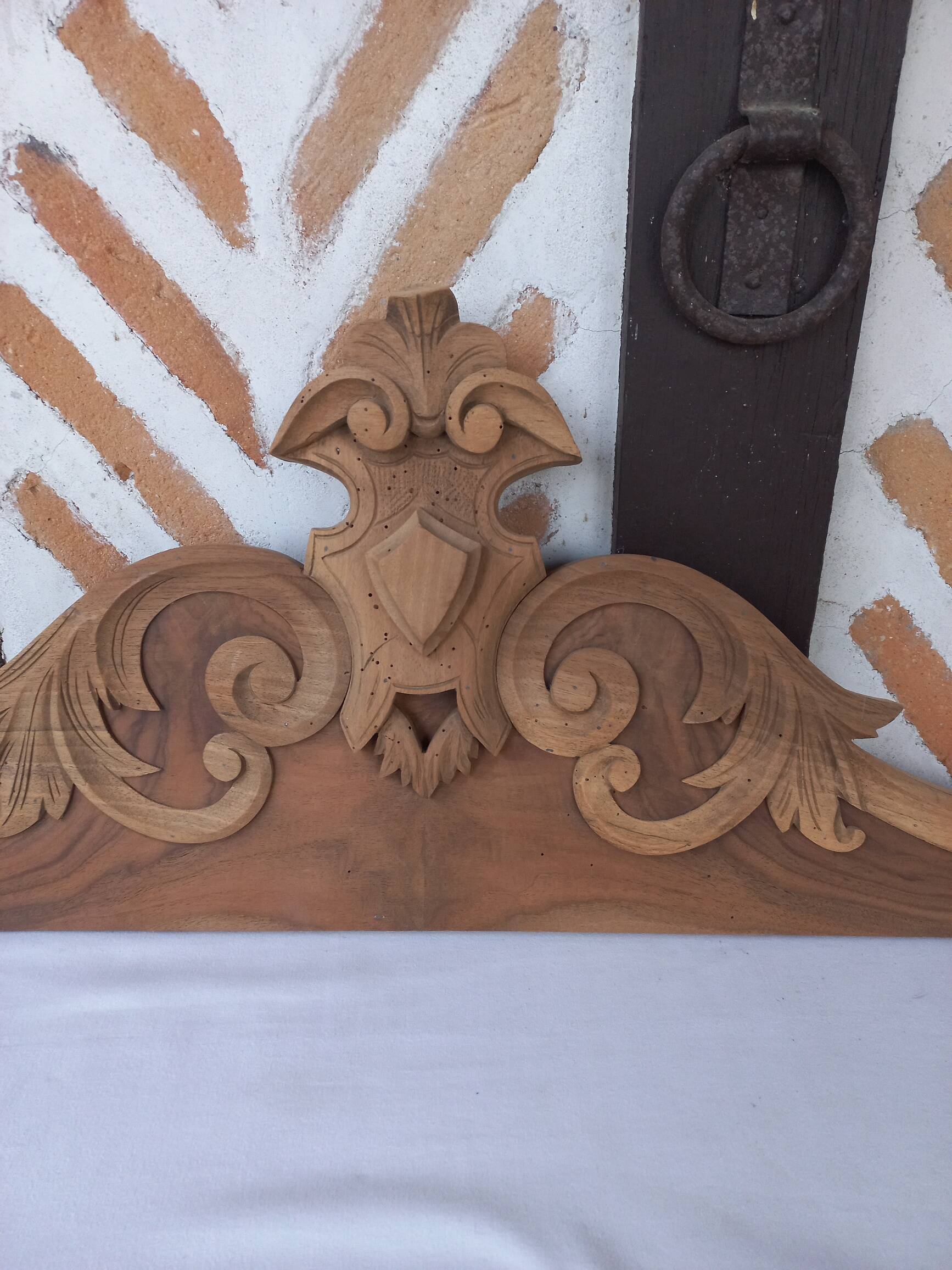 Old sandblasted wooden pediment