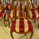 12 chairs in oak, carved wood with fleurette decorations, fabric seat