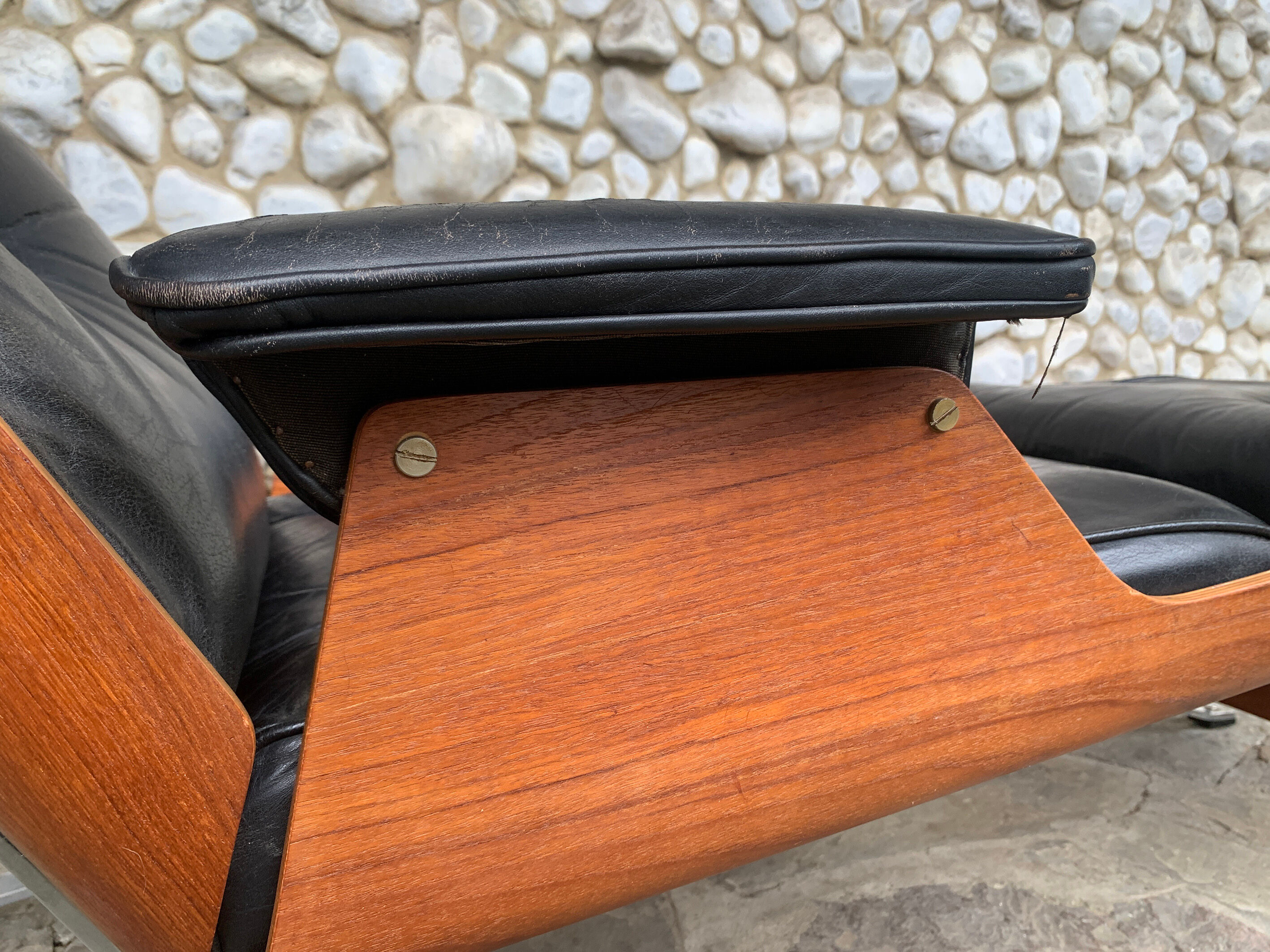 Lounge chair and ottoman black leather and teak multiplex, 1960