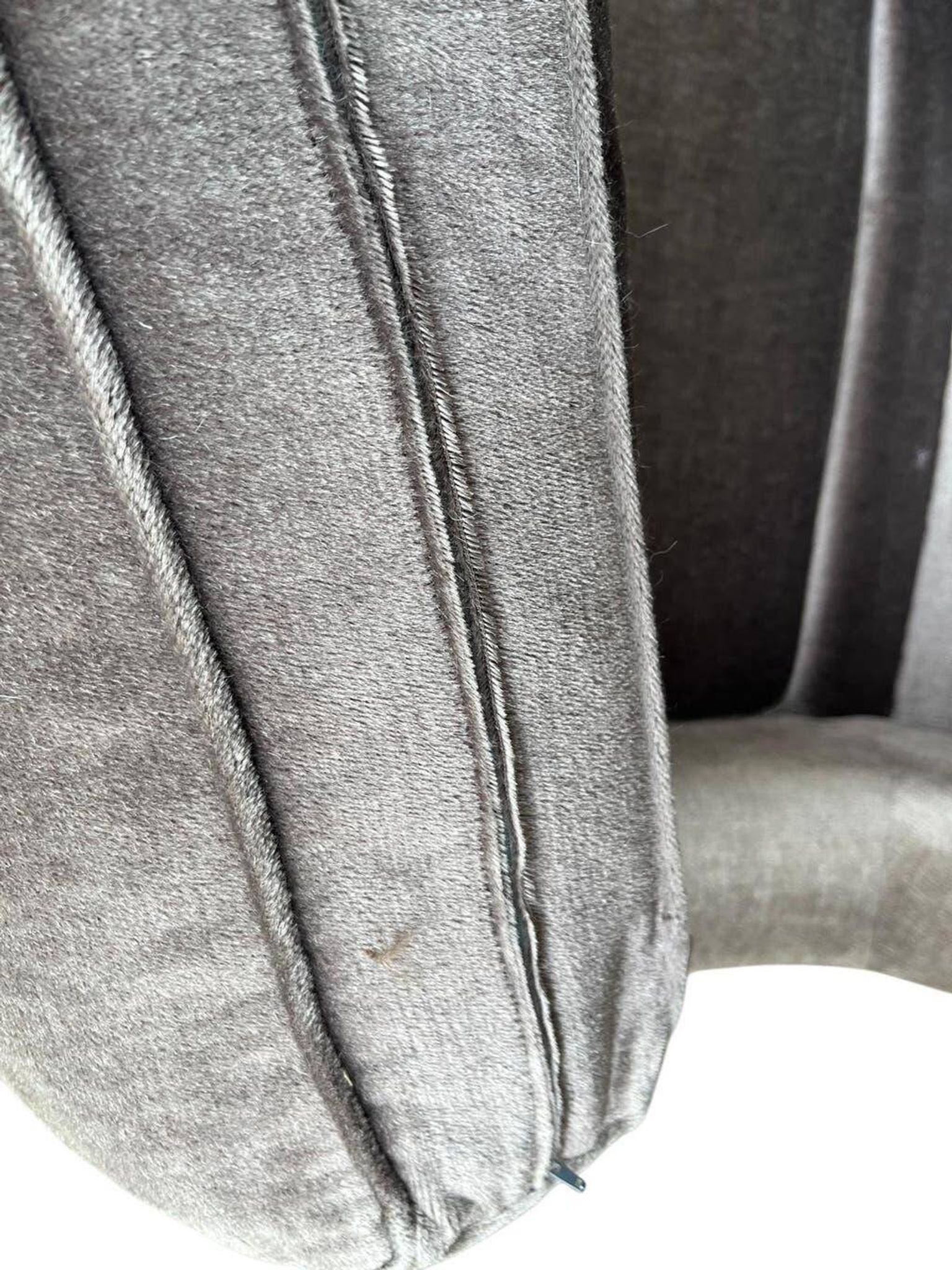 Vintage taupe two-seater armchair/sofa with fringes.