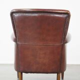 Sheepskin armchair correctly finished with decorative nails and in good condition