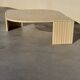 Large designer coffee table in travertine, eye shape, Roche Bobois edition from the 80s