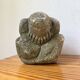 Stone sculpture of a man