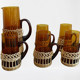 Fruit juice or vintage lemonade service in glass and wicker.