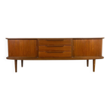 Vintage teak sideboard with rounded edges and sliding doors – mid-century Scandinavian design.