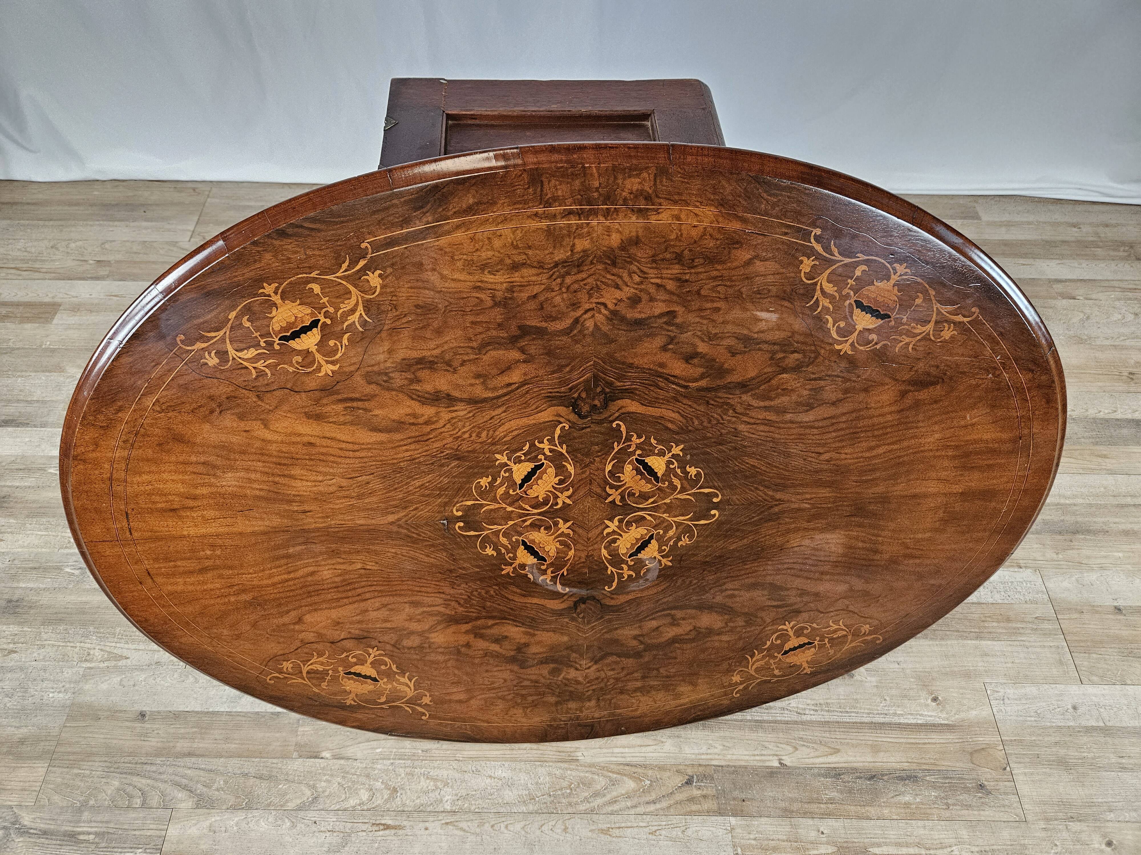 Coffee table in walnut with maple inlays and wheels