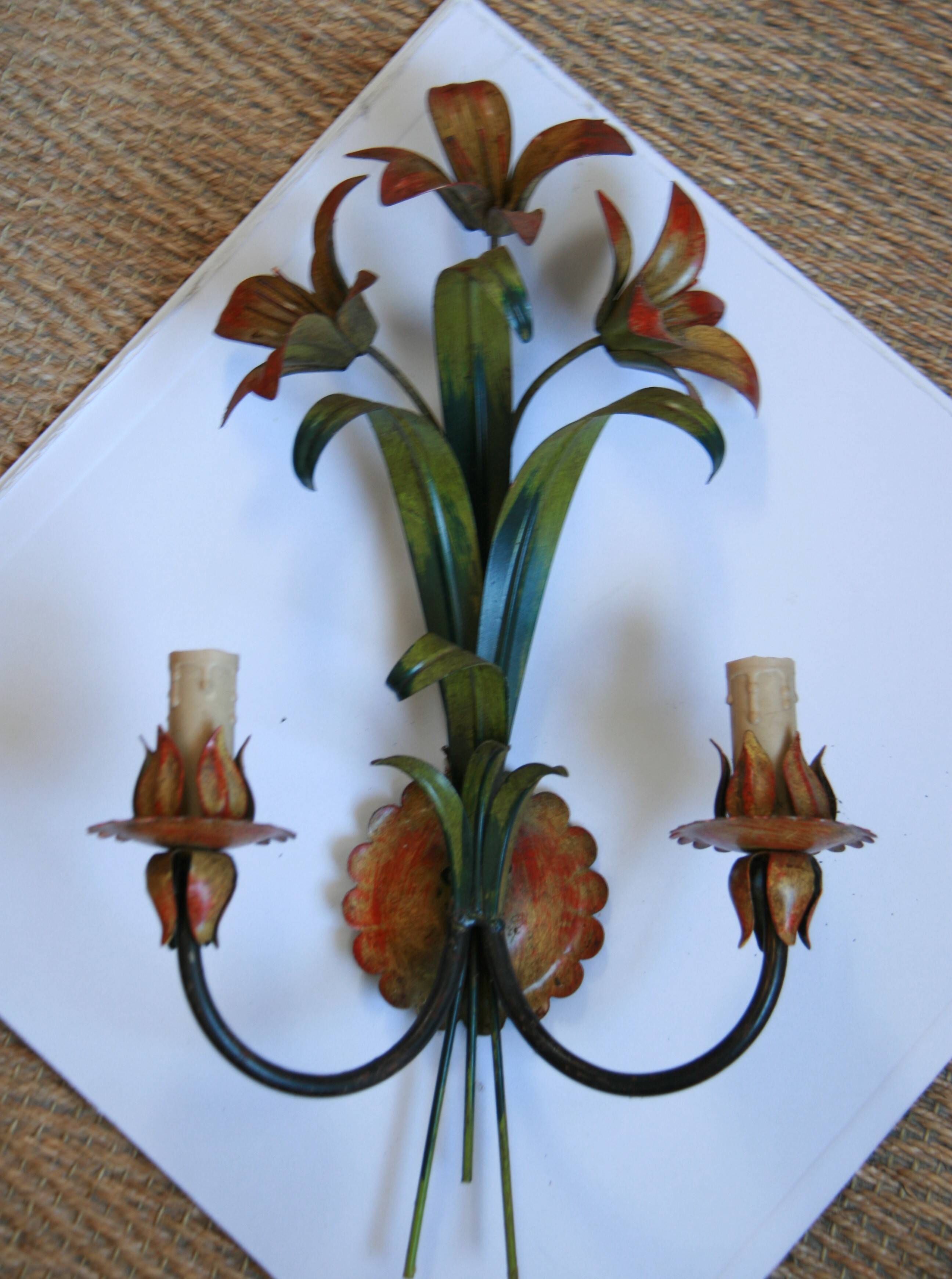 Pair of vintage floral wall sconces in Italian Florentine style metal.