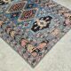 Vintage Kazak rug with geometric oriental motifs, 100% wool.